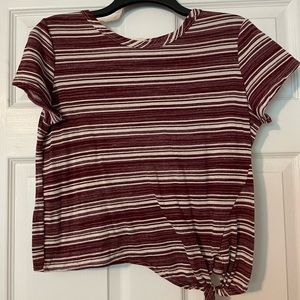 Cropped maroon and white striped t-shirt.